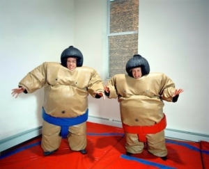 Two people in sumo inflating suits... ready to play antistress fight simulation